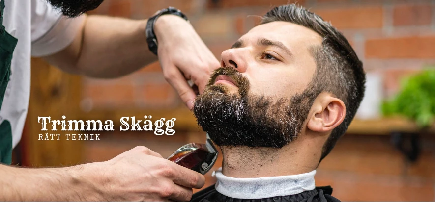 Barberare trimmar skägget med maskin